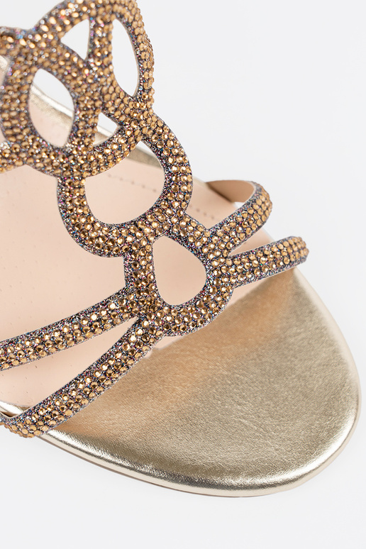 gold color slippers on the heel...