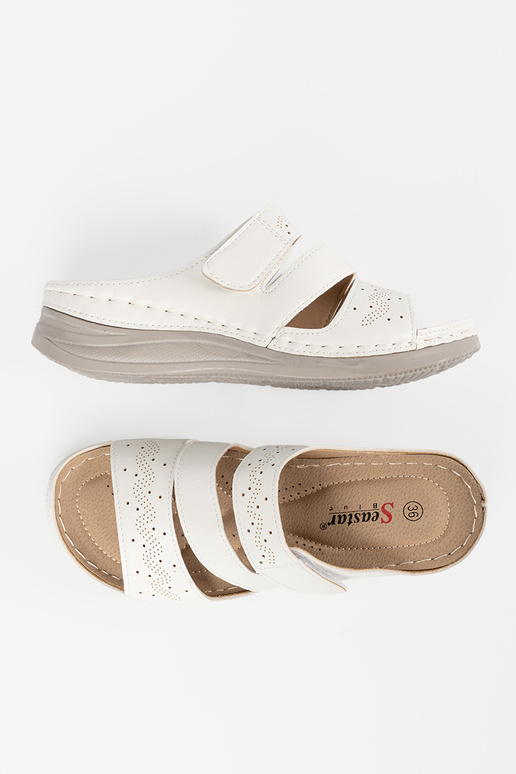 Easy Inhite color slippers on a loIn...