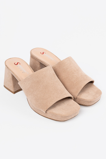 beige Inomens slippers on... 2