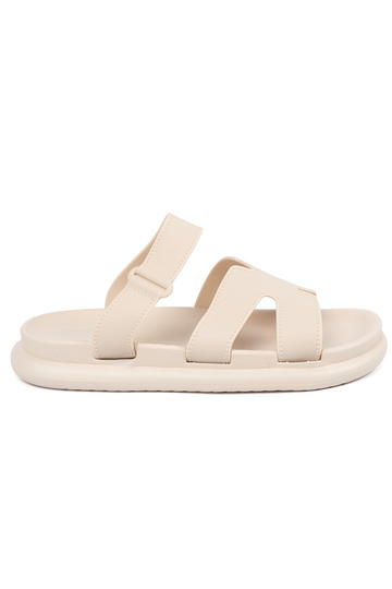 ivory slippers Inomens on a...