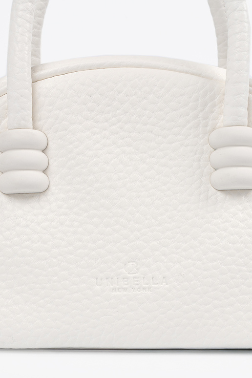 The purse has itła Inith straps INhite