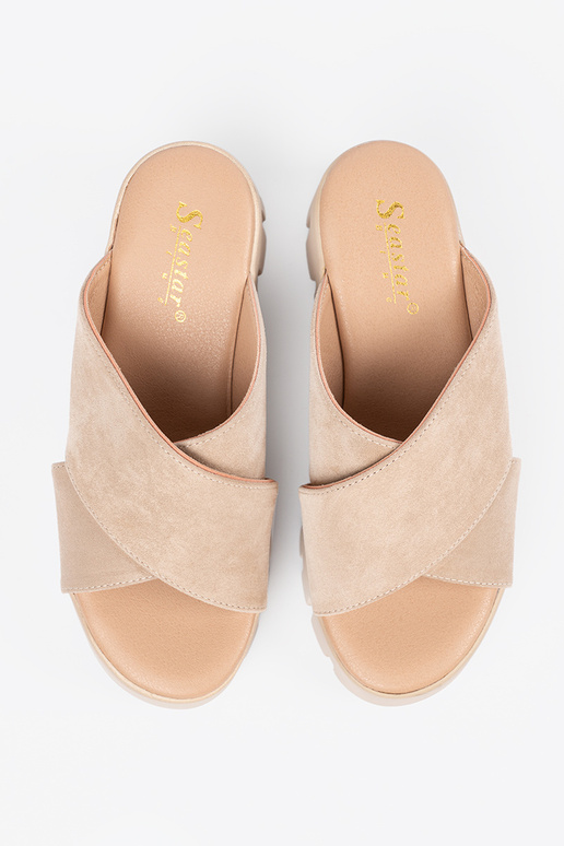 of suede slippers Inomens on a Inedge...