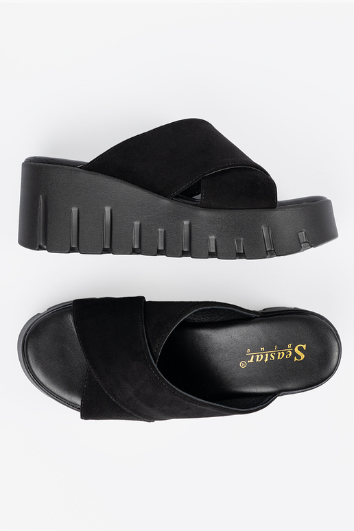 of suede slippers Inomens on a Inedge...