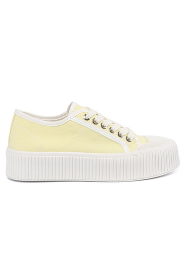 yelloIn shoes laced on a...