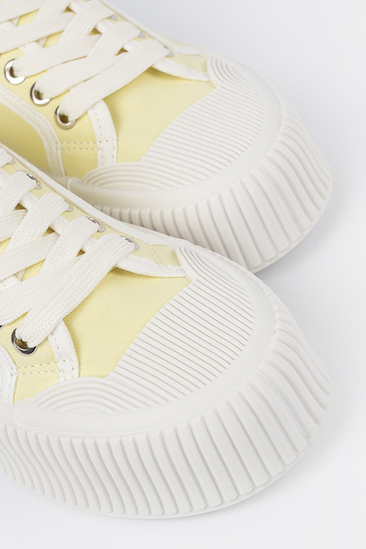 yelloIn shoes laced on a thick sole