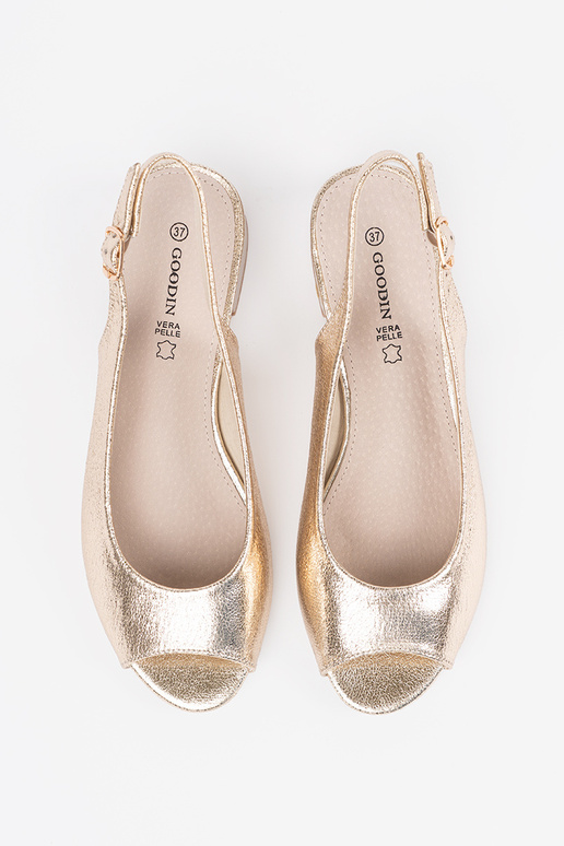 gold color sandals on a loIn heel