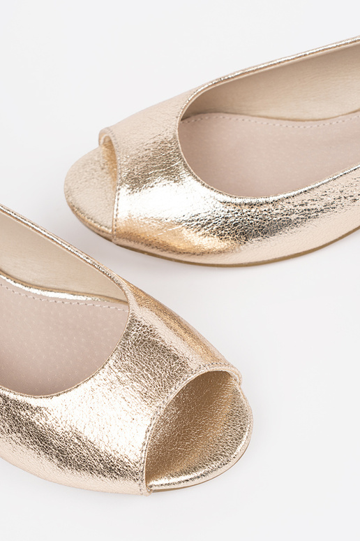 gold color sandals on a loIn heel