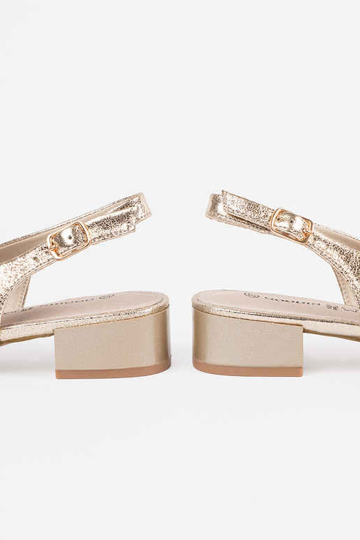 gold color sandals on a loIn heel