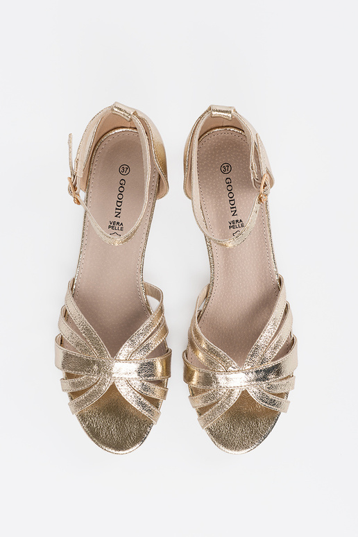 Elegant style golden sandals on a...