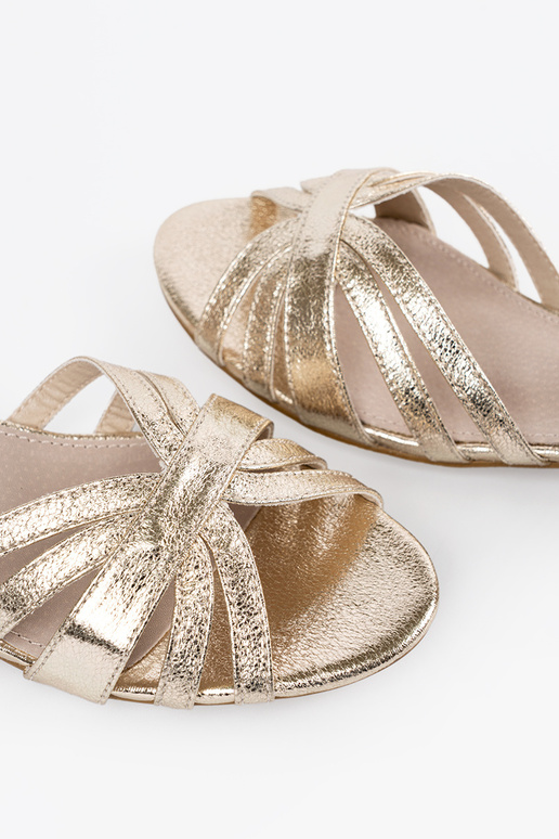 Elegant style golden sandals on a...