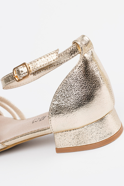 Elegant style golden sandals on a...