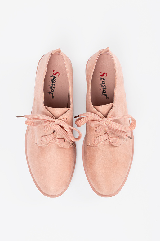 Light pink hue shoes tied