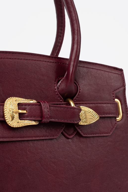 burgundy Handbag Inith a decorative buckle In goldenm kolorze