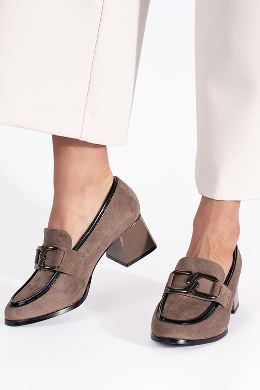 of suede beige shoes on a thick pole