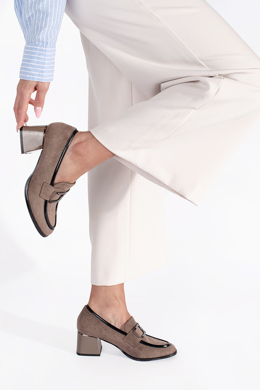 of suede beige shoes on a thick pole