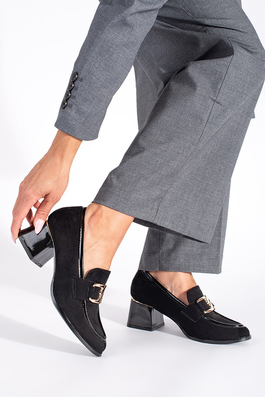 of suede Inomens shoes on a thick pole