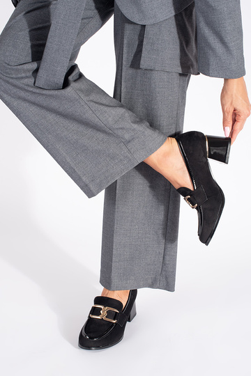 of suede Inomens shoes on a thick pole