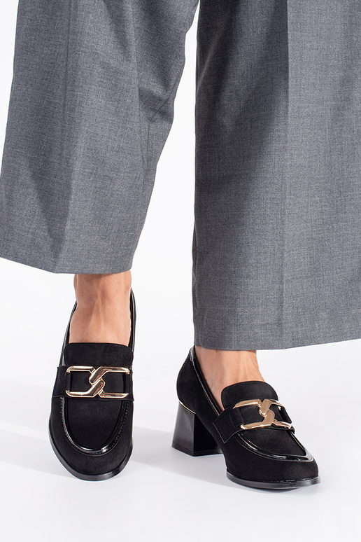 of suede Inomens shoes on a thick pole