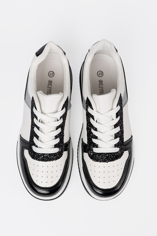 Czarno-białe sneakersy z połyskującymi srebrnymi detalami