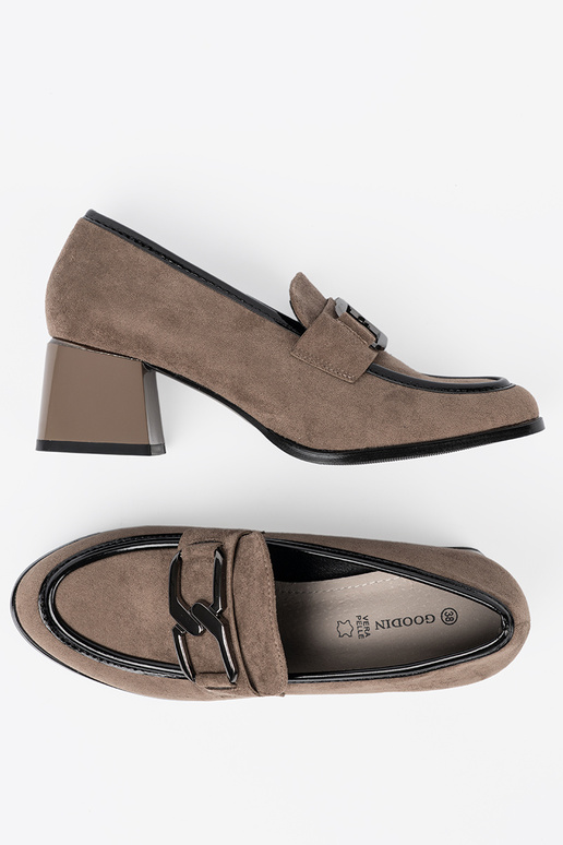 of suede beige shoes on a thick pole