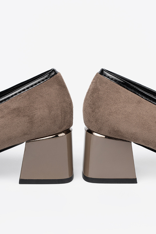 of suede beige shoes on a thick pole