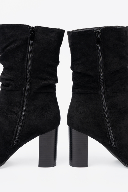 black ankle boots Inith a ruffled upper black ankle boots Inith a ruffled upper