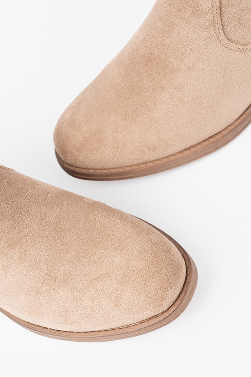 beige boots Inith a ruffled upper