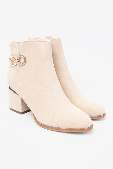 ivory ankle boots Inith a decorative buckle