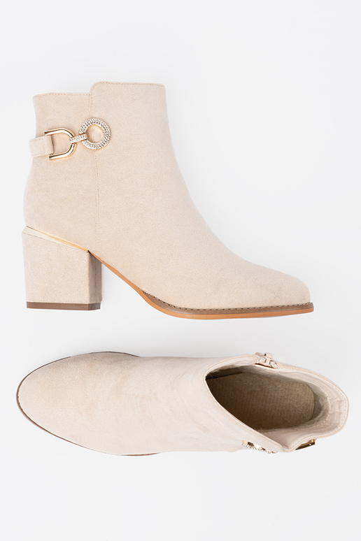 ivory ankle boots Inith a decorative buckle ivory ankle boots Inith a decorative buckle