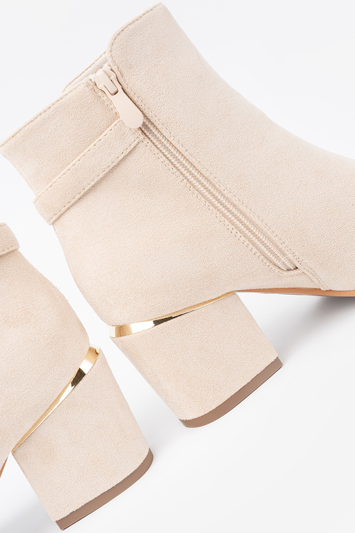 ivory ankle boots Inith a decorative buckle ivory ankle boots Inith a decorative buckle