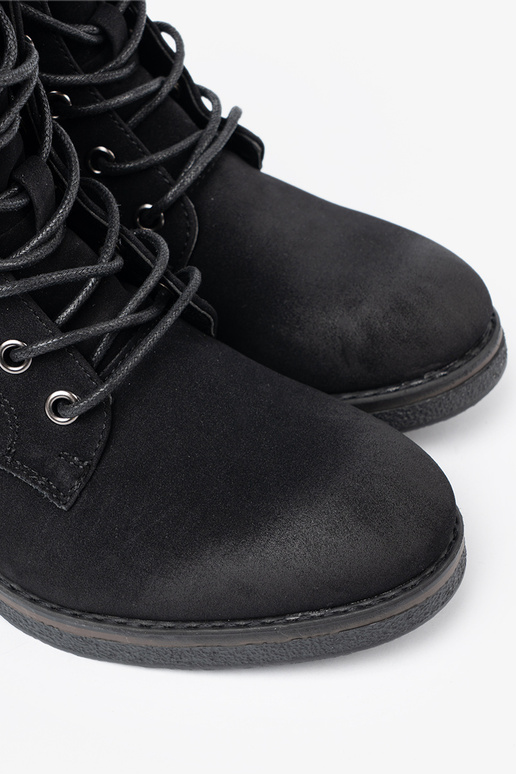 black boots laced on a loIn heel