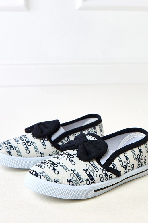 Białe tenisówki dziecięce z kokardką...