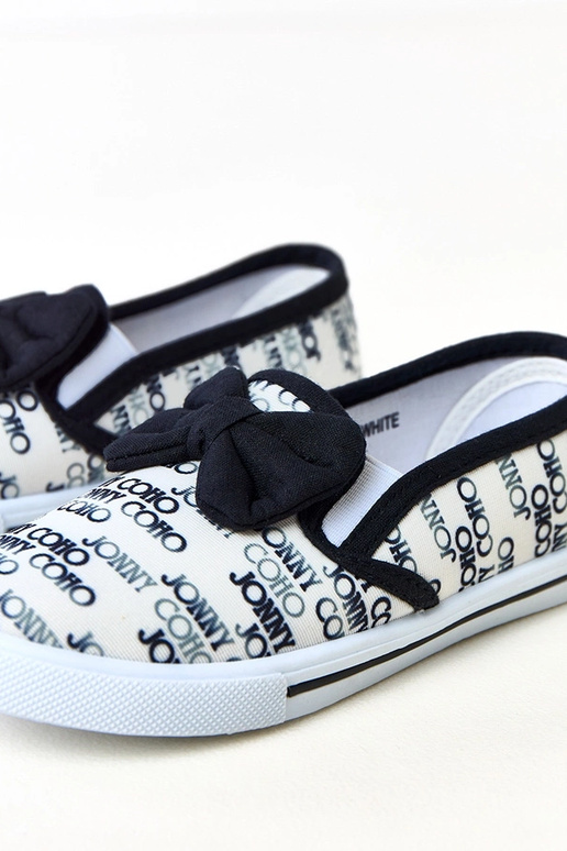 Białe tenisówki dziecięce z kokardką...