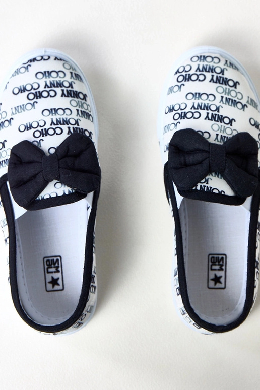 Białe tenisówki dziecięce z kokardką...