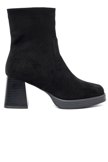 Elegant style black boots on a stable pole 2