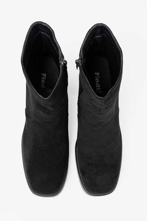 Elegant style black boots on a stable pole