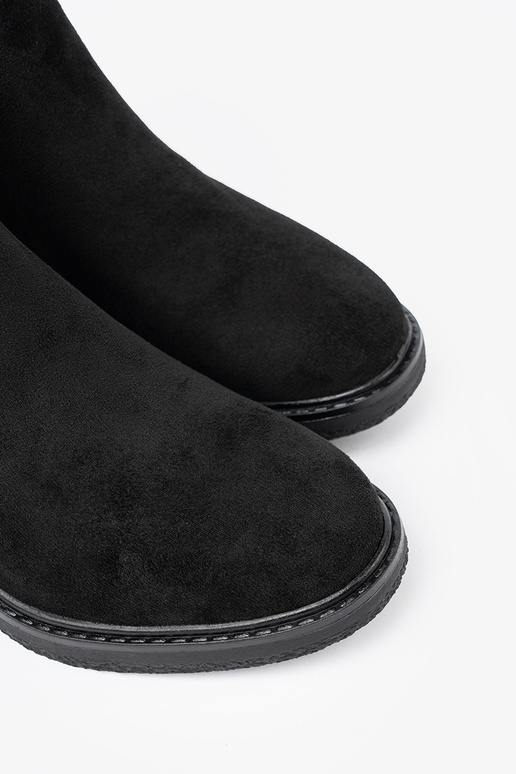 black boots Inith buckles on a stable heel