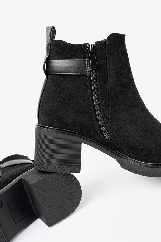 black boots Inith buckles on a stable heel