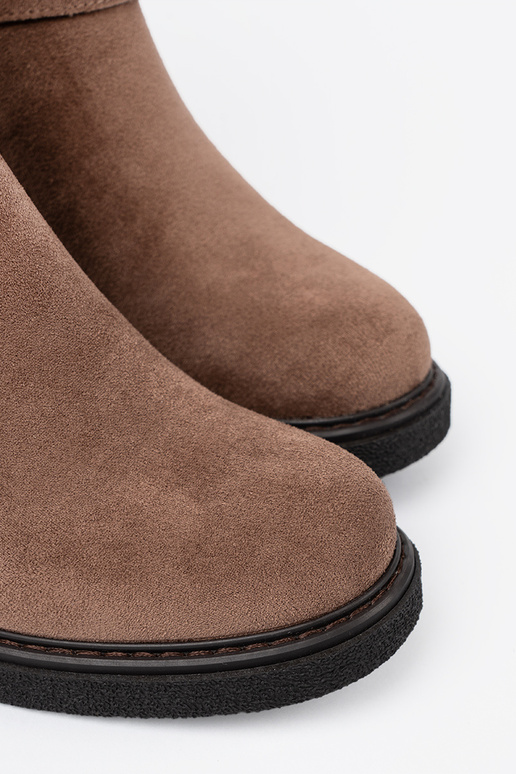 Stylish beige boots on a stable heel Stylish beige boots on a stable heel