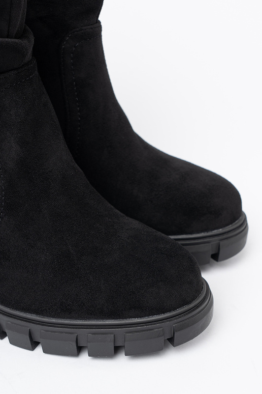 Stylish black boots Inith a ruffled upper