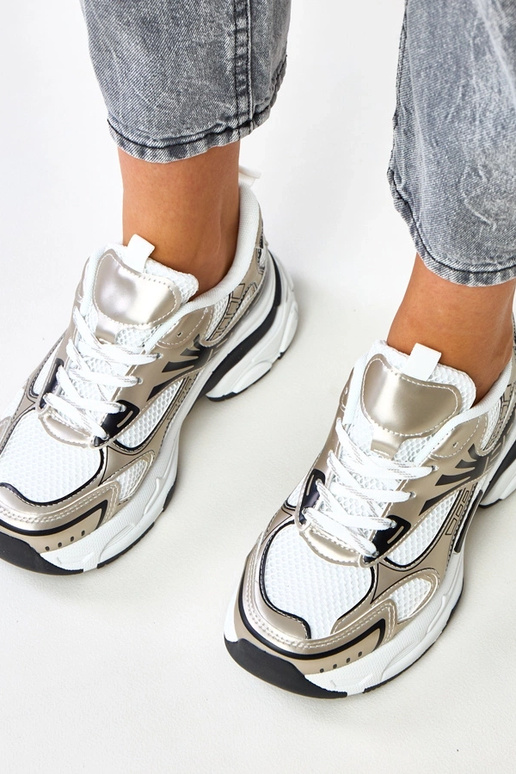 Złote sneakersy sportowe na masywnej... Złote sneakersy sportowe na masywnej...