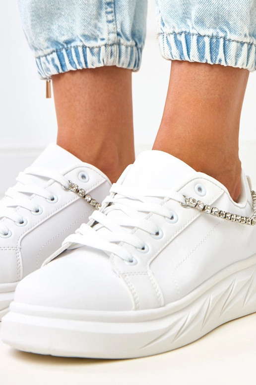 Białe sneakersy na platformie z... Białe sneakersy na platformie z...