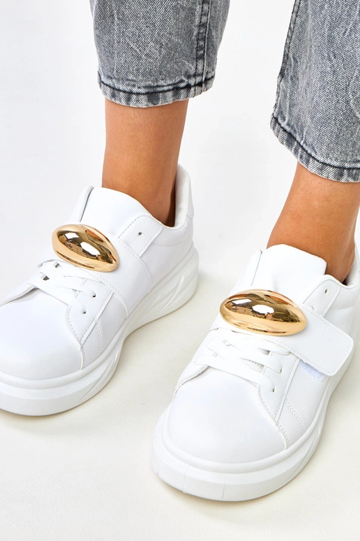 Białe sneakersy na platformie ze... Białe sneakersy na platformie ze...