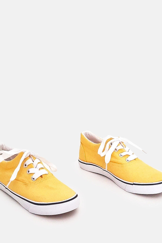 Żółte dziecięce tenisówki na...