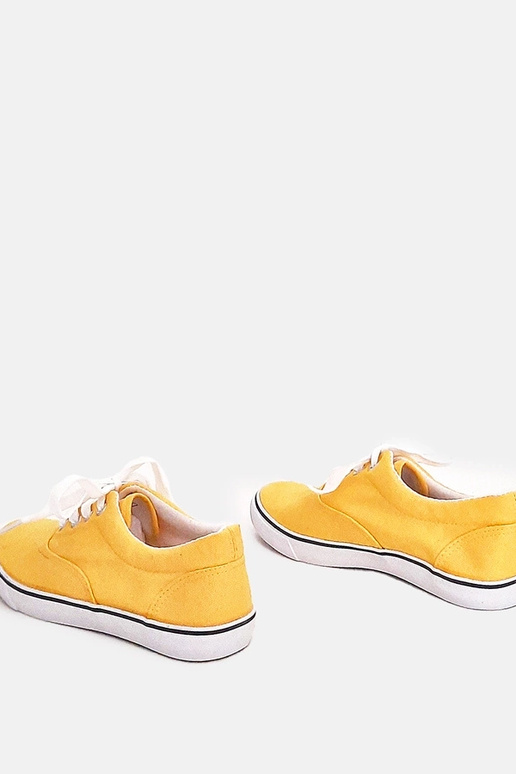 Żółte dziecięce tenisówki na...