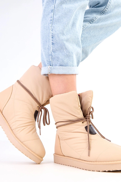 Beżowe śniegowce damskie z ozdobnym...