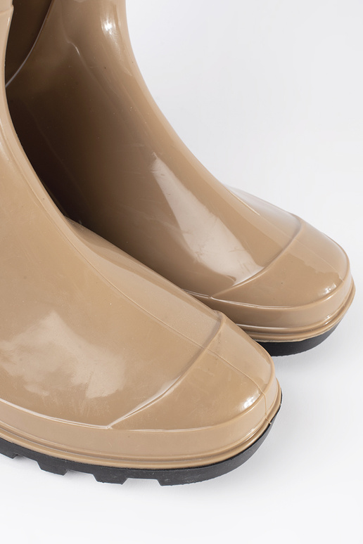 beige lacquered rubber boots