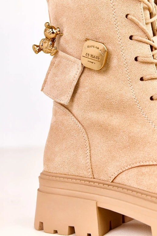 Beżowe traperki zdobione misiem i...