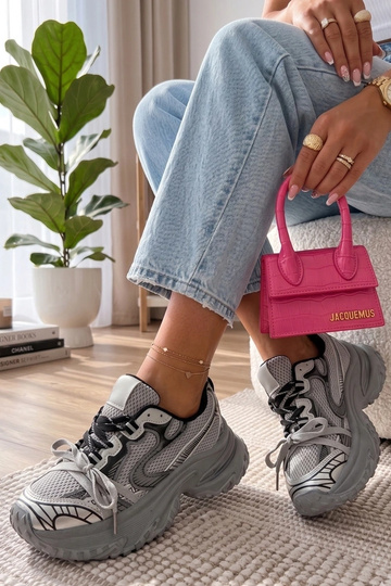 Gray sneakers on a chunky...
