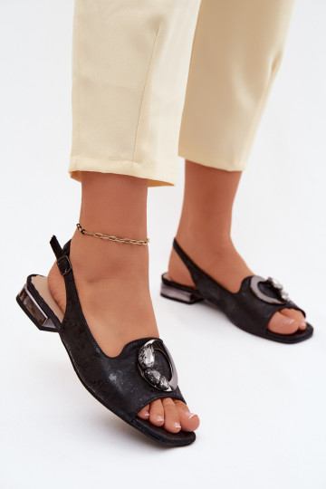 Flat sandals for women with ornaments in black color